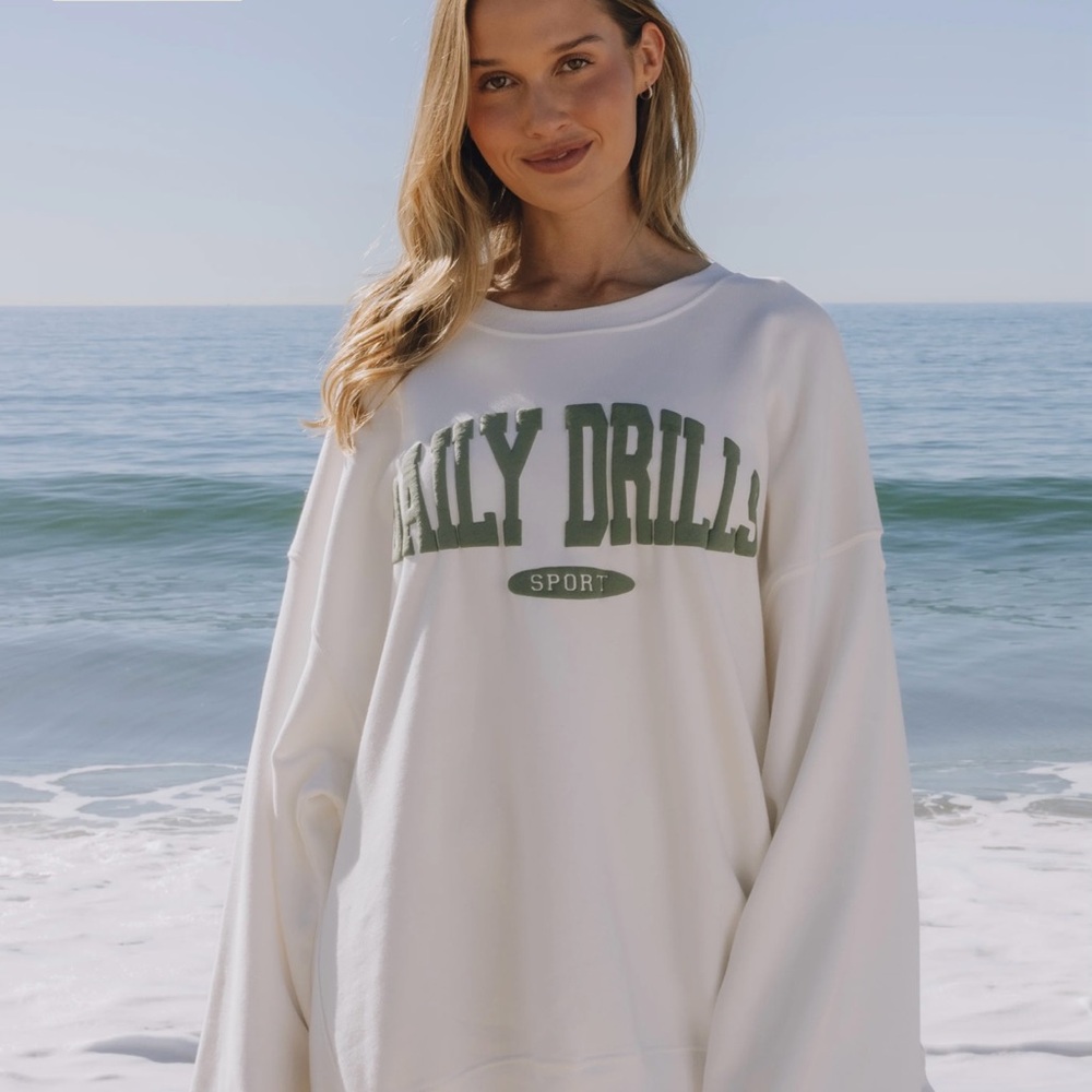 Daily Drills Cream Sweatshirt with Green Lettering